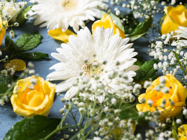 istock Floral background with yellow and white flowers on blue 1438622099
