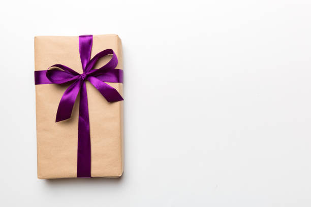 Holiday present box over colored background, top view. Copy space for design.