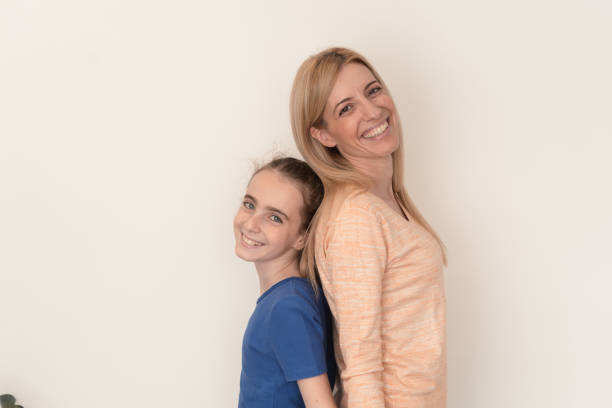 Young woman and girl having a great time together
