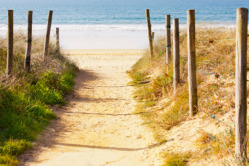 Wooden path on the beach with ocean view. Portugal