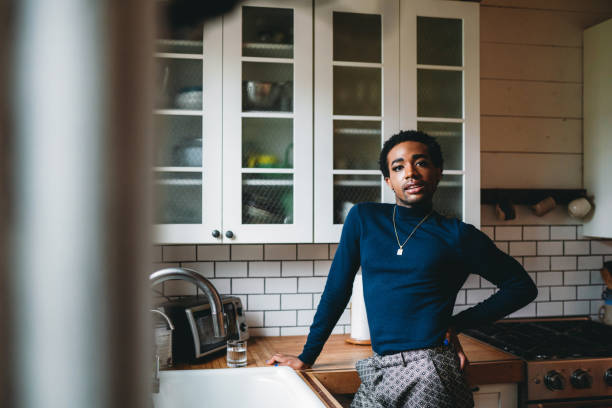 istock Portrait of a non-binary person in the kitchen 1438625721