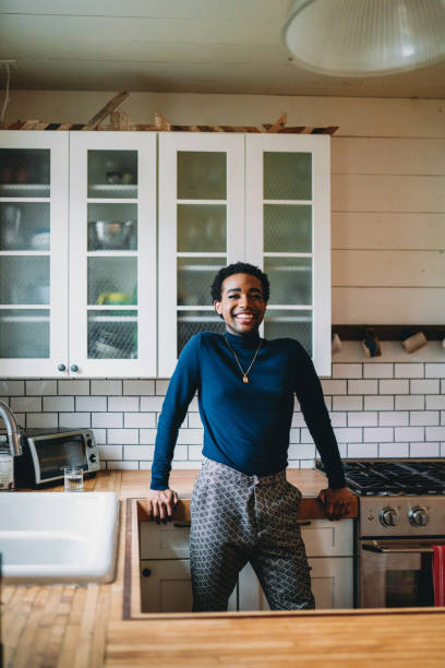 istock Portrait of a non-binary person in the kitchen 1438625772
