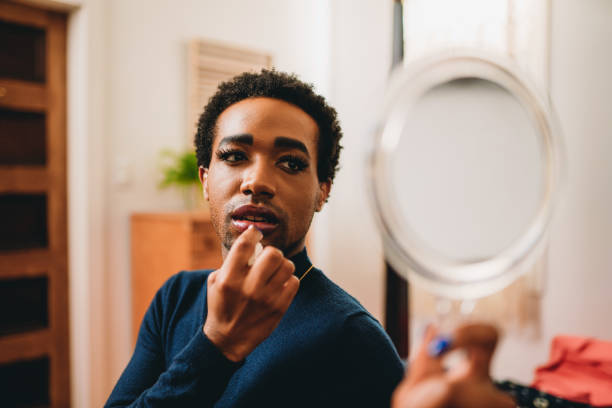 istock Non binary person is putting on makeup up in the bedroom 1438625987