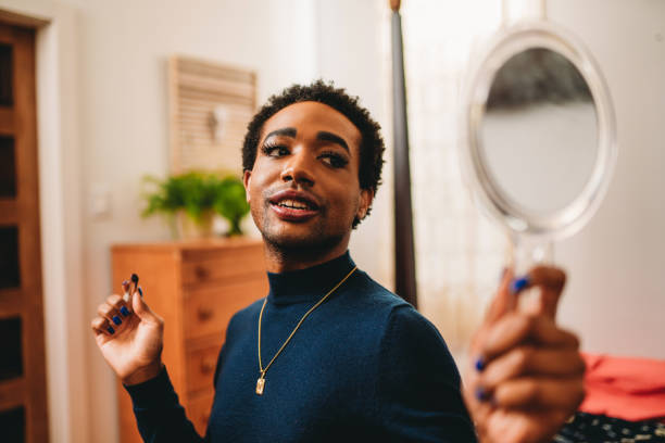 istock Non binary person is putting on makeup up in the bedroom 1438626007
