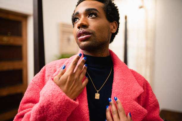 istock A non-binary person is wearing a pink coat 1438626344