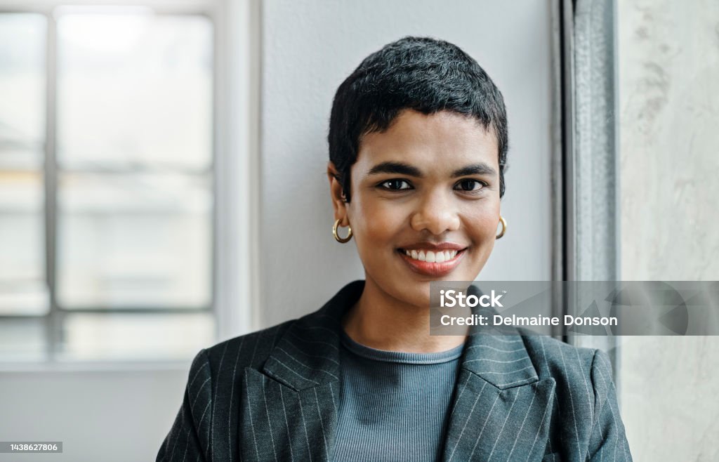 Portrait, smile and happy interior designer with motivation, vision or ideas for real estate staging and Indian property decor.  Woman, creative worker and employee with building marketing innovation 25-29 Years Stock Photo