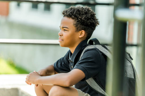 istock African american school boy with backpack outside 1438631106