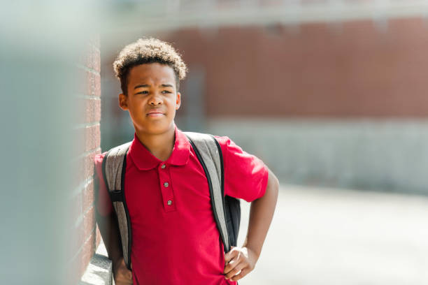 istock African american school boy with backpack outside 1438631113