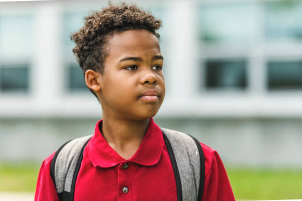 istock Smiling african american school boy with backpack 1438631148