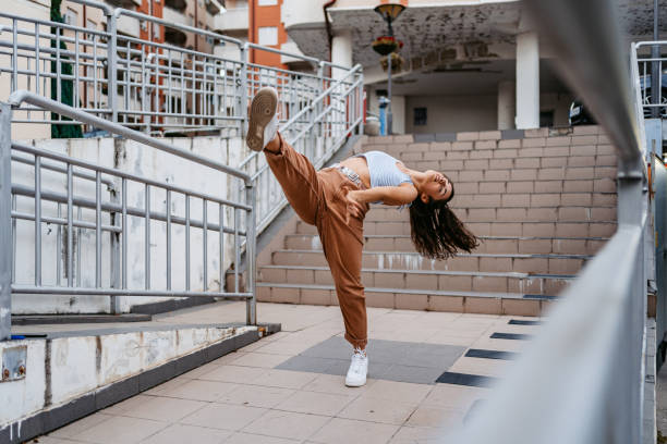istock Young Woman Dancing Outdoors 1438632890