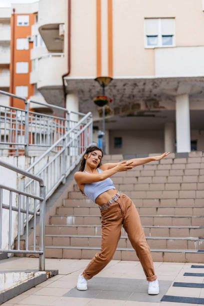 istock Young Woman Dancing Outdoors 1438632936