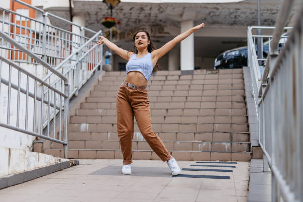 istock Young Woman Dancing Outdoors 1438633020