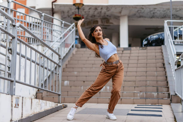 istock Young Woman Dancing Outdoors 1438633088