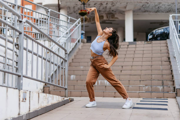 istock Young Woman Dancing Outdoors 1438633212