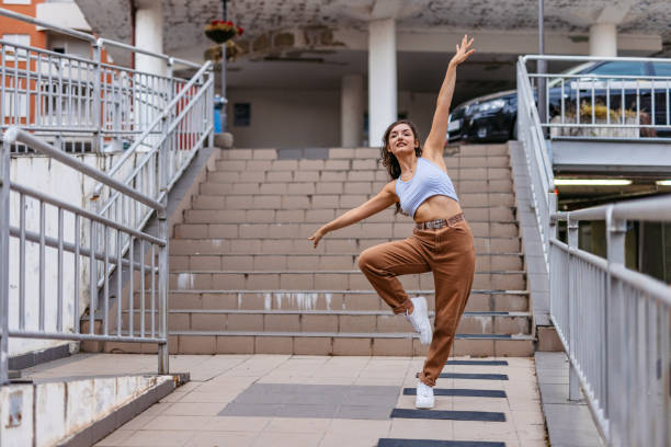 istock Young Woman Dancing Outdoors 1438633322