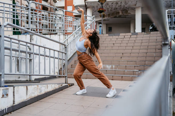istock Young Woman Dancing Outdoors 1438633387