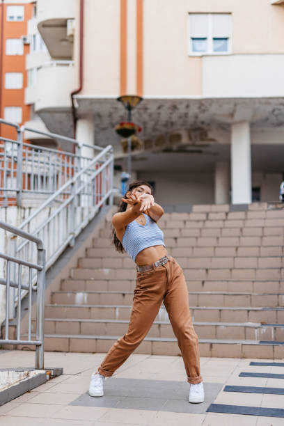 istock Young Woman Dancing Outdoors 1438633407