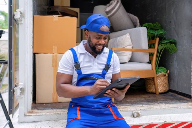 istock Delivery house move cargo truck service man checking box list from digital tablet for signature 1438633420