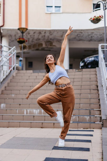 istock Young Woman Dancing Outdoors 1438633430