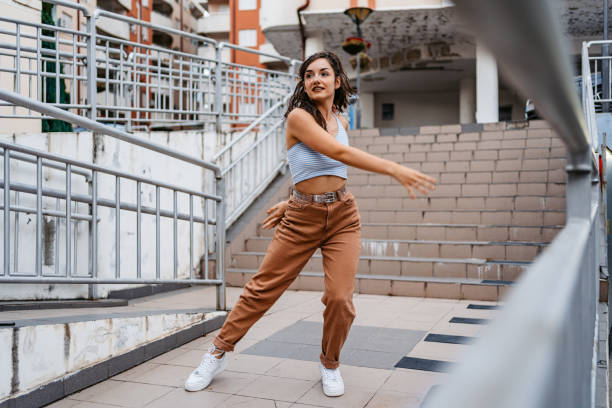 istock Young Woman Dancing Outdoors 1438633492