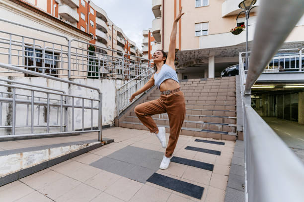 istock Young Woman Dancing Outdoors 1438633520