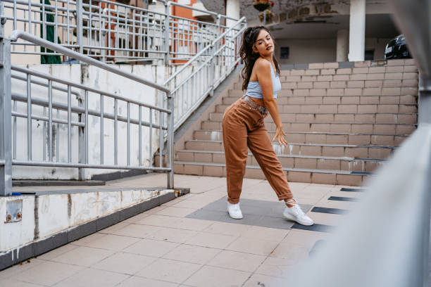 istock Young Woman Dancing Outdoors 1438633585