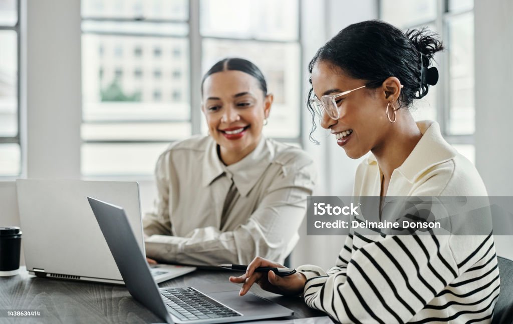 Business women, laptop and and happy team in office  for web design, collaboration and training. Planning, digital marketing and coaching by woman leader menor help, explain and support creative goal Marketing Stock Photo