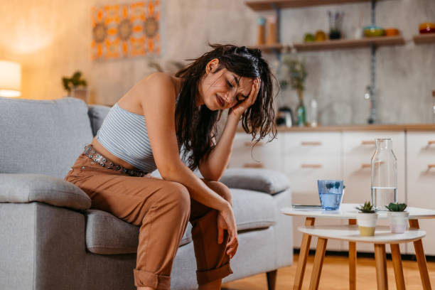 istock Young Woman Having A Headache At Home 1438635106