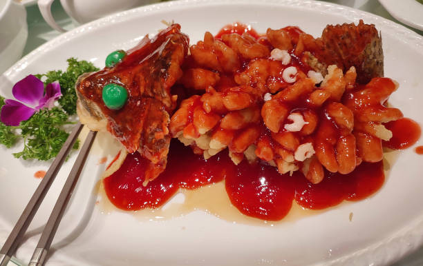 fresh squirrel mandarin fish with red tomato sour and sweet sauce