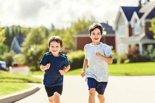 The kids running Outdoor activities by running make the child's body healthy and experience enriched