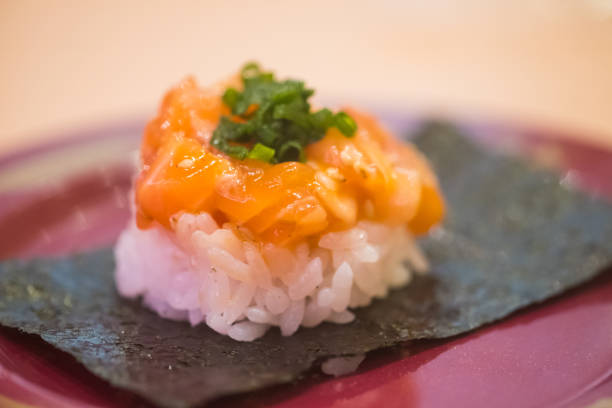 Sushi salmon with rice placed on seaweed. Close up