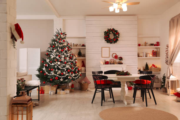 istock Cozy dining room interior with Christmas tree and festive decor 1438637106