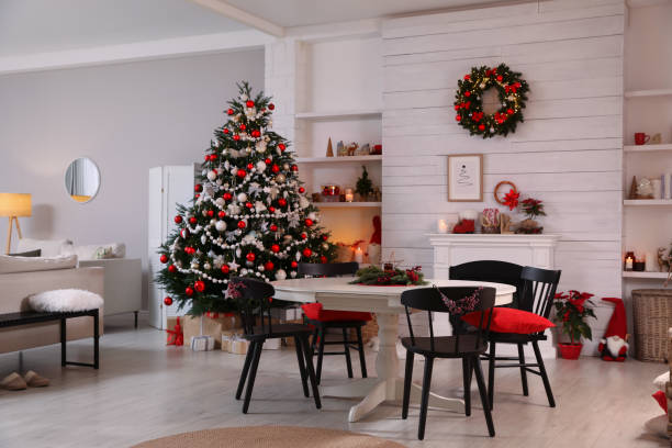 istock Cozy dining room interior with Christmas tree and festive decor 1438638888