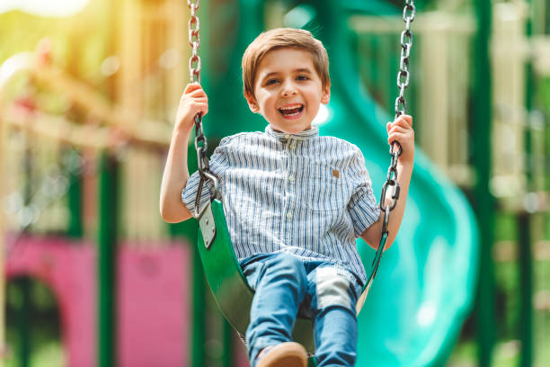 istock Baby boy having fun on a swing. 1438639269