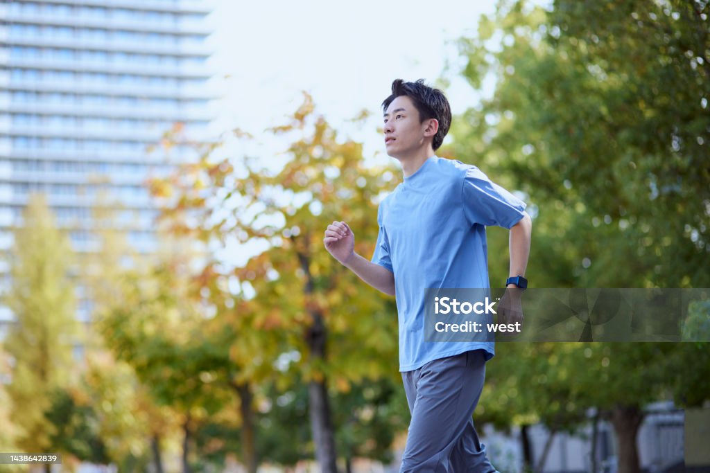Young Japanese man wearing sportswear Men Stock Photo