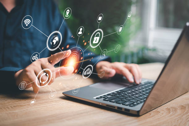 istock Fingerprint scanning and biometric authentication,Businessman Fingerprints on virtual screens use laptop  processing of biometric for access personal security data scanning of digital programs 1438644709