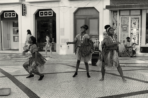 Lisbon, Portugal - July 2, 2022: A group of african dancers performs at the Rua Augusta street in Lisbon downtown.
