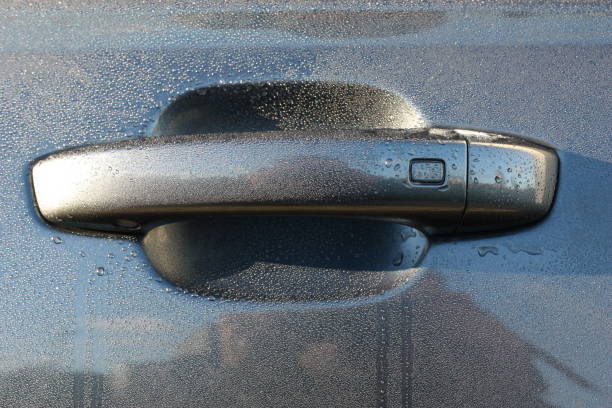 istock Door handle of modern gray (Daytona gray pearl effect) car with keyless entry system 1438644986