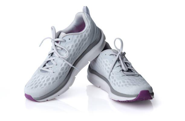 istock Gray sport running shoes isolated on white background 1438647498