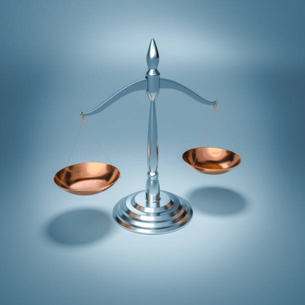 istock scales of justice on a light blue background. 1438648689
