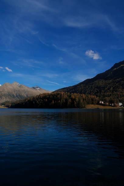 istock Vertical shot of the river surrounded by mountains covered with forest 1438652278