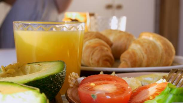 istock Close-up breakfast, a full breakfast with croissants and scrambled eggs with vegetables, fruits, everything you need to keep your body in good shape. Proper nutrition is the key to success and health. 1438655399