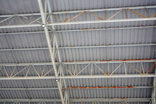 Steel structure with large metal sheet roof.