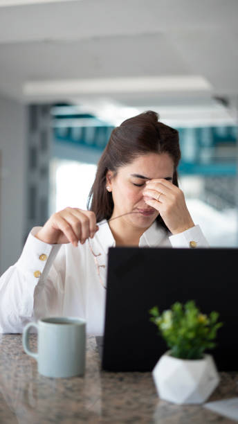 istock Business woman overworked, looks tired 1438658047