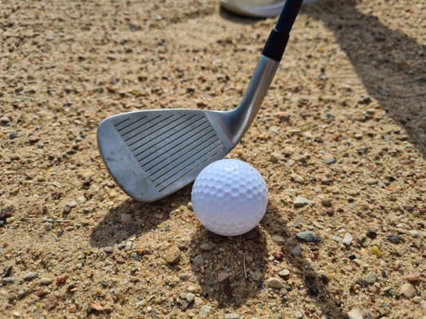 istock Golf players hitting ball with sandblasting closeup 1438660282
