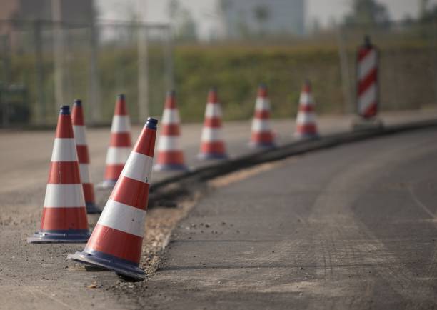istock Red and white roadblocks next to each other during daytime 1438661308