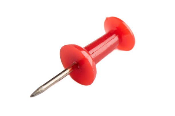 istock Macro shot of a red pushpin isolated on a white background. 1438662417