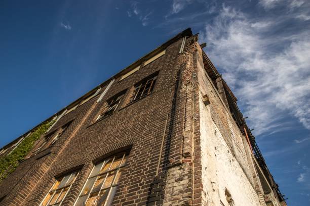 istock Low angle shot of an old stone building under the sky with a few clouds 1438662633