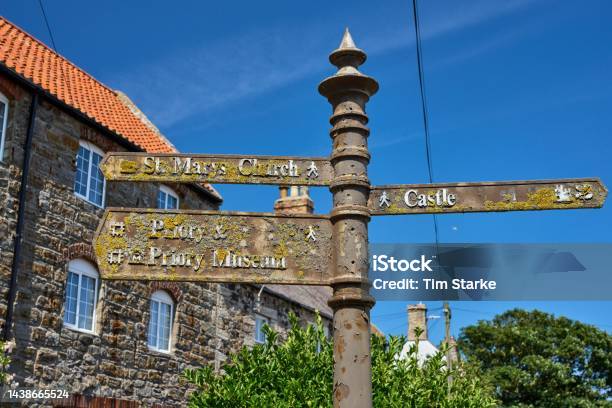 Moss And Lichencovered Signpost Stock Photo - Download Image Now - Ancient, Architecture, Arrow Symbol