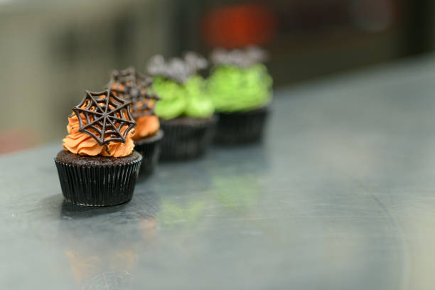 Chocolate Cupcakes Cream topped with a little chocolate with strawberry jelly to decorate